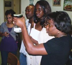 Students look at a lionfish specimen.